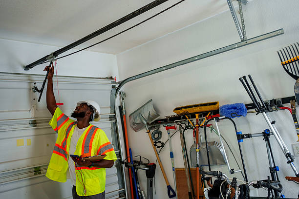 Professional Garage Door Installation technician working in White Cloud, MI
